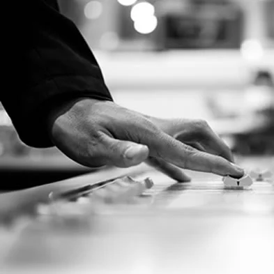 hand-on-fader-of-console